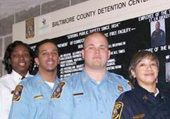 Become a correctional officer! Image of uniformed corrections officers.