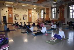 Seniors doing yoga at the Ateaze Senior Center